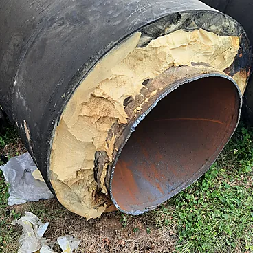 Fire-damaged insulated pipe documented during the assessment
